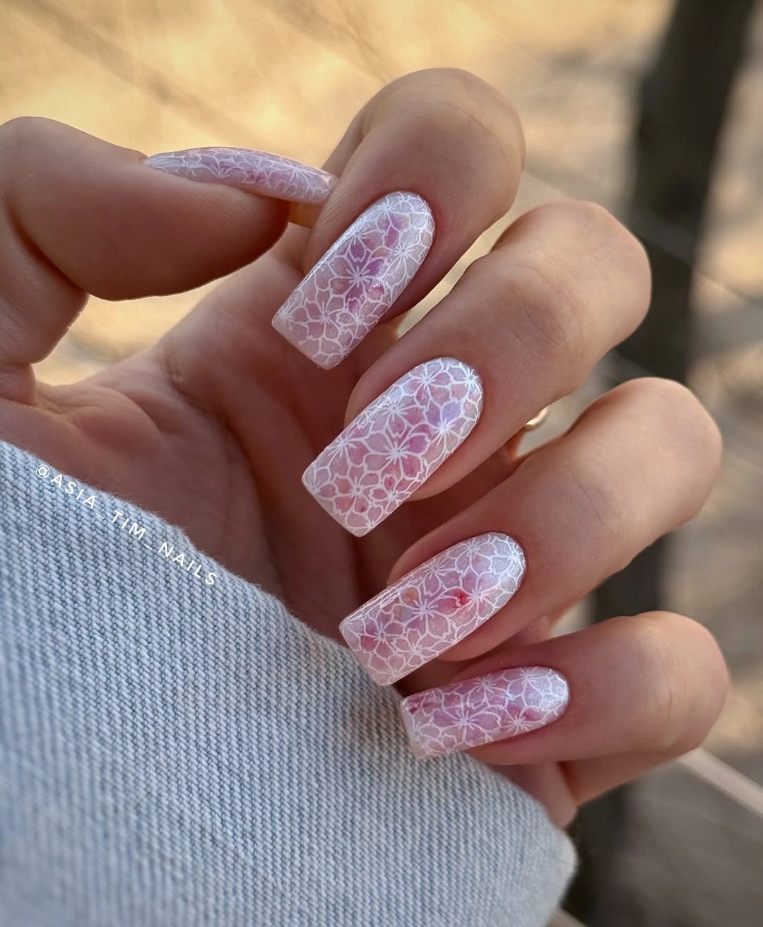 pink square nails with white lace floral pattern