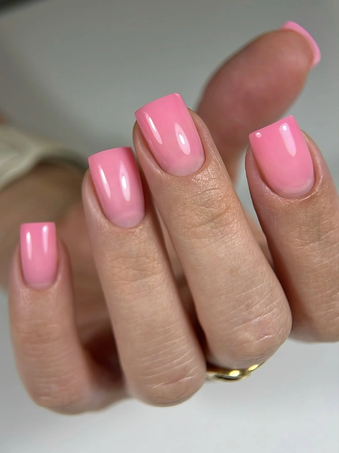 glossy pink medium square nails with soft base fade