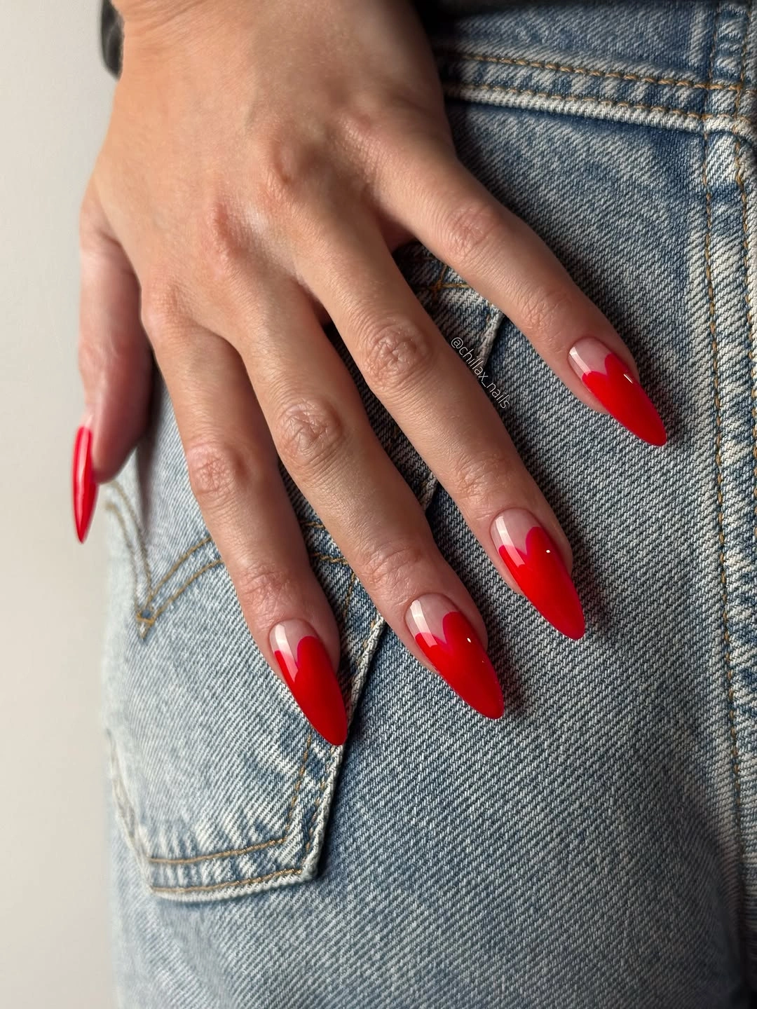 Fall nail art 2026 Red Almond Nails With Tiny White Heart Accents