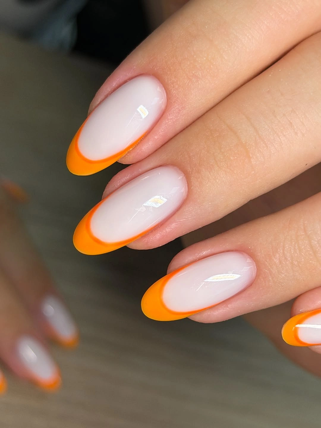 Fall nail art 2026 Orange French Almond Nails With Sheer Centers