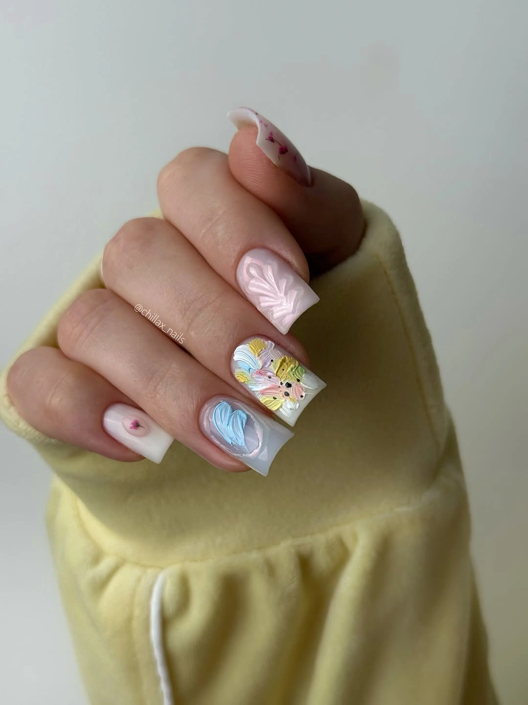 Fall nail art 2026 Pastel Mixed Nails With Clouds and Confetti Details