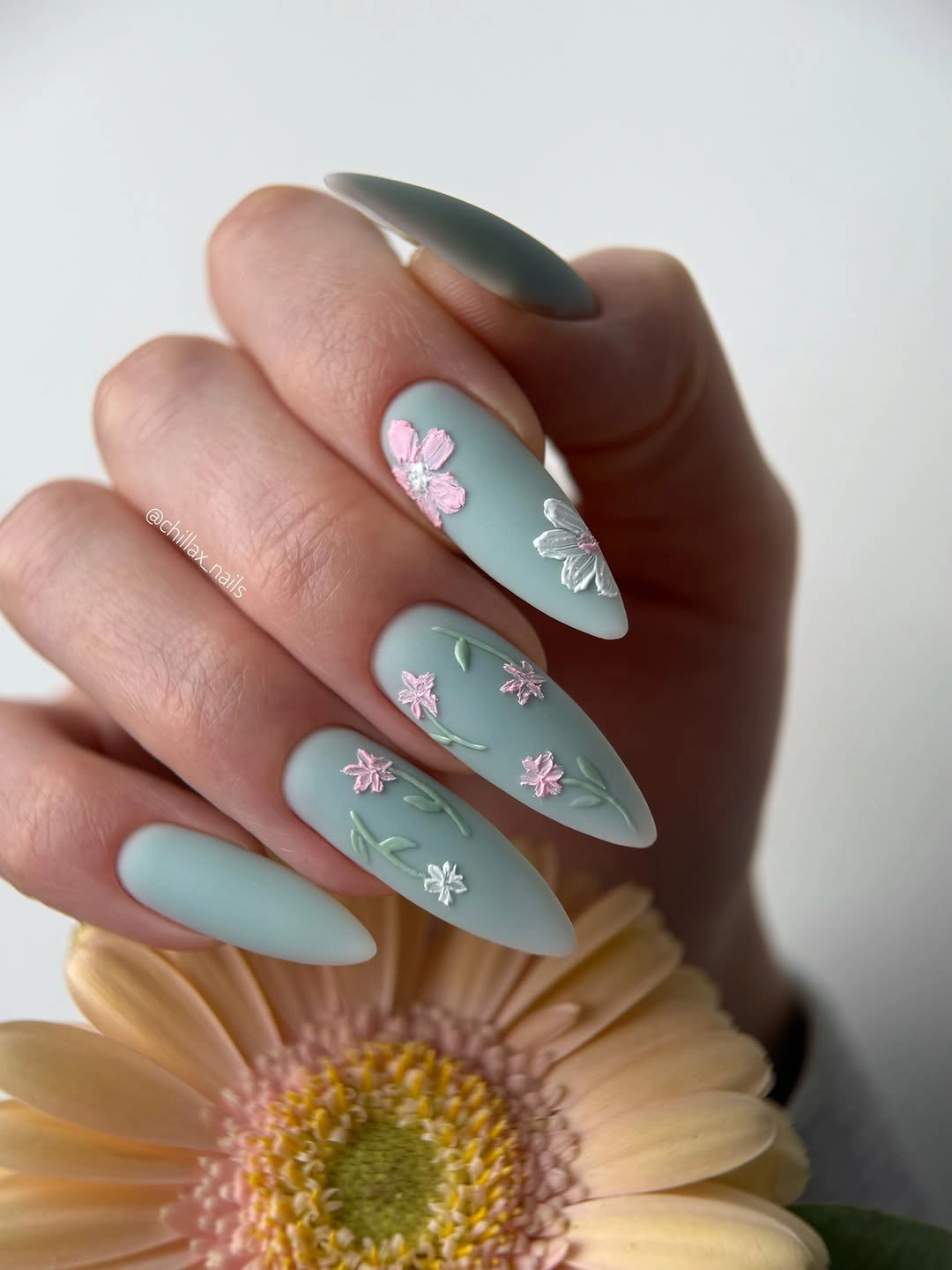 Fall nail art 2026 Sage Almond Nails With Tiny Floral Accents