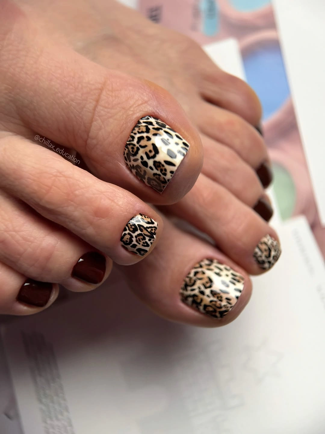 leopard print pedicure with dark brown accent toenails
