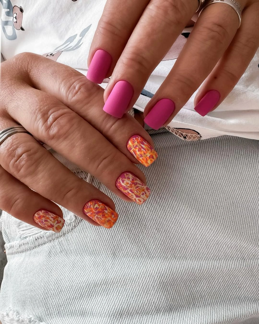Fall short nails 2026 Magenta Short Nails With Orange Pattern Accents