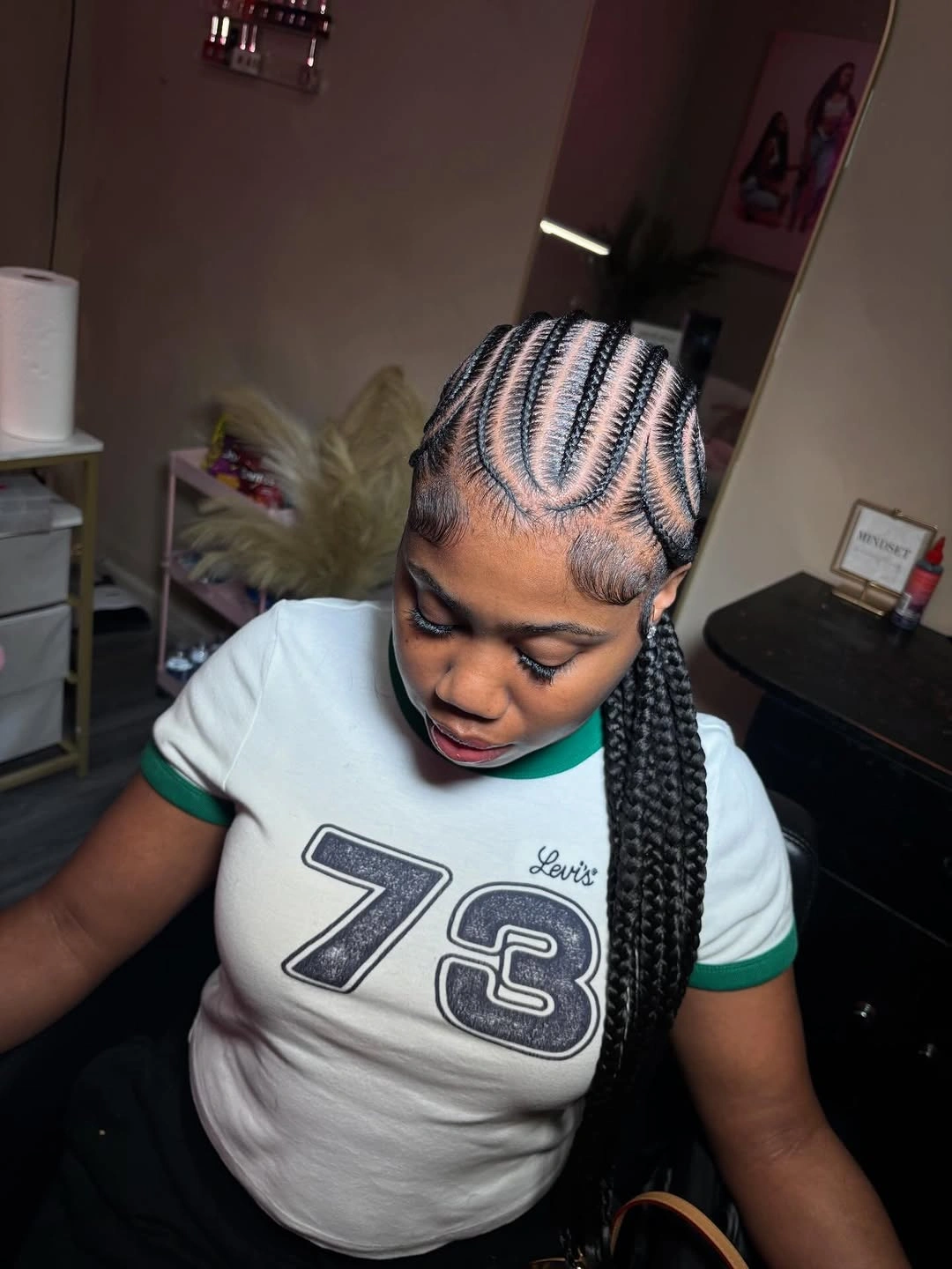 feed in braid hairstyles Curved Feed-In Cornrows with a Sleek Side Ponytail