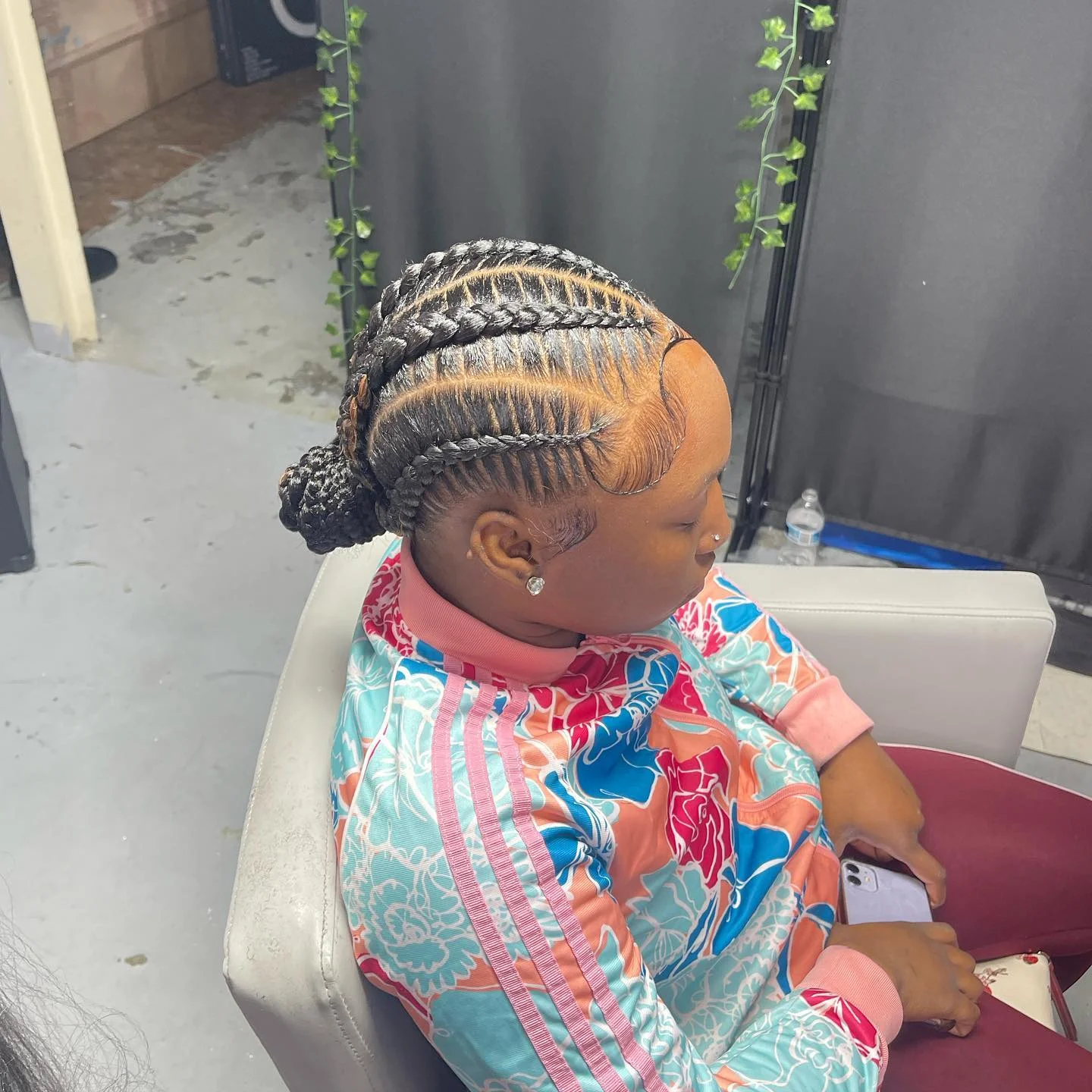 feed in braid hairstyles Elegant Feed-In Braided Low Bun with Defined Side Parts