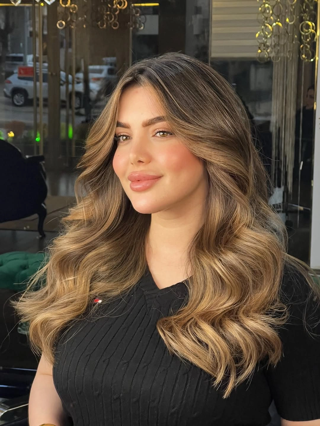Hair Lowlights: Color Ideas and Inspiration Golden Face-Framing Lowlights for Bright Dimensional Brunettes
