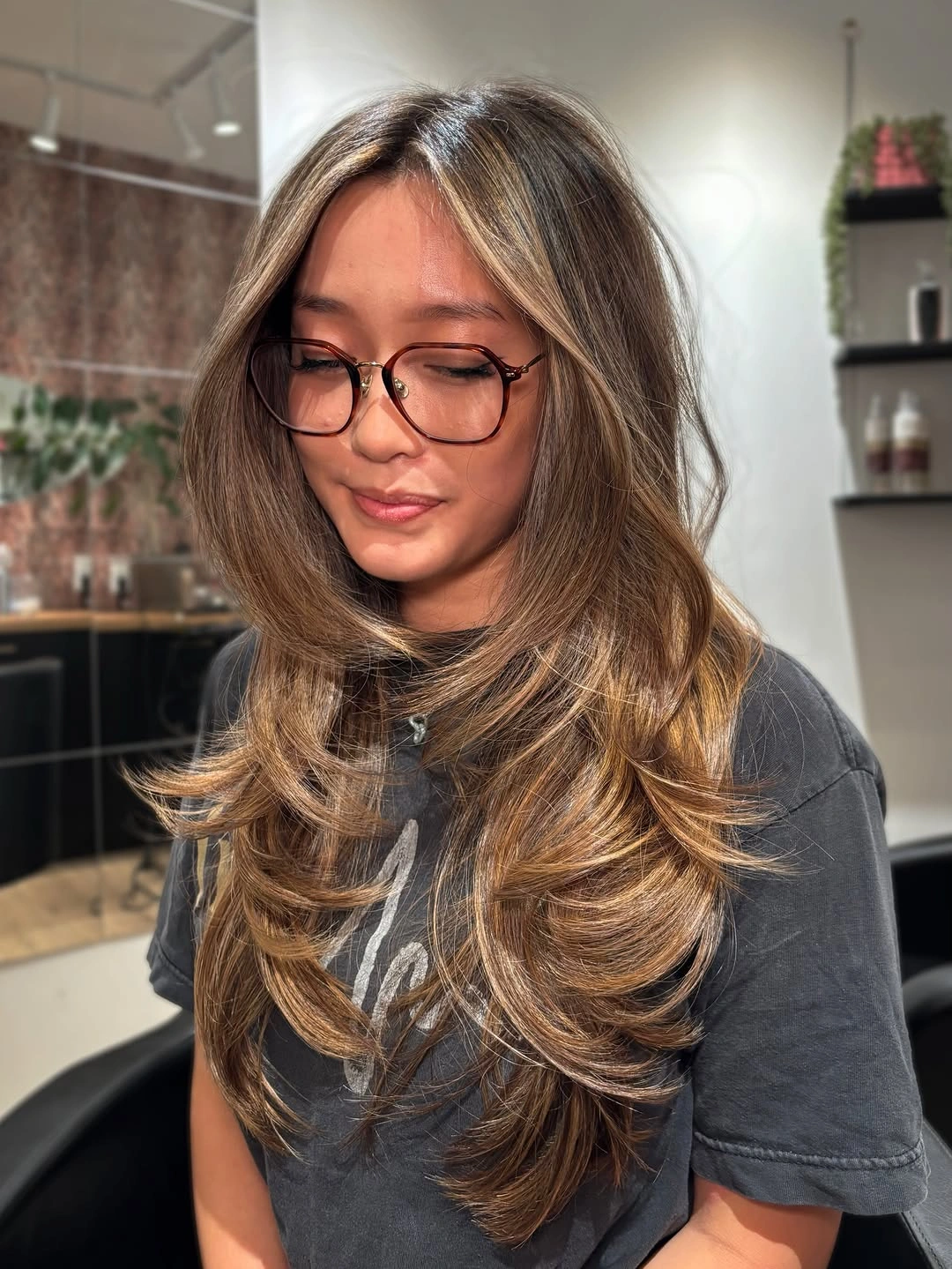 Hair Lowlights: Color Ideas and Inspiration Layered Butterfly Volume with Warm Brunette Dimension