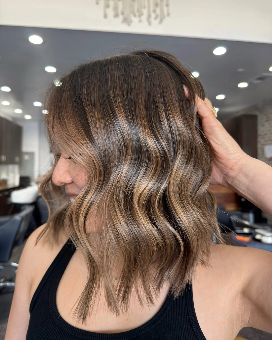 Hair Lowlights: Color Ideas and Inspiration Textured Shoulder-Length Lowlights for an Effortlessly Modern Bob