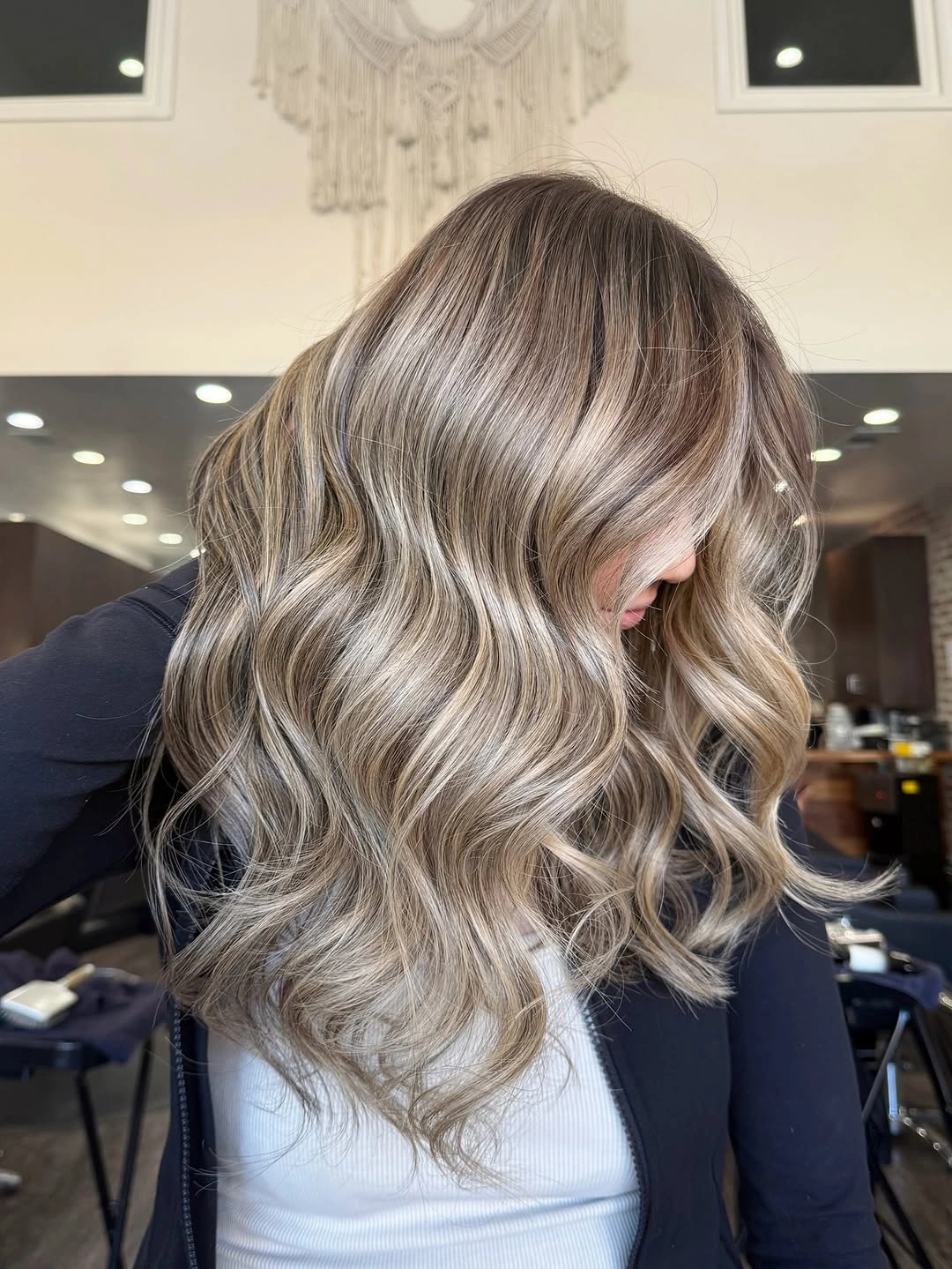 Hair Lowlights: Color Ideas and Inspiration Cool Beige Blonde Lowlights with Airy Dimensional Waves