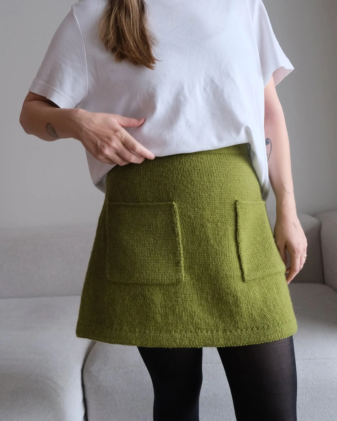 knit skirt outfits fall 2026 Green Short Knit Skirt With A Simple White Tee