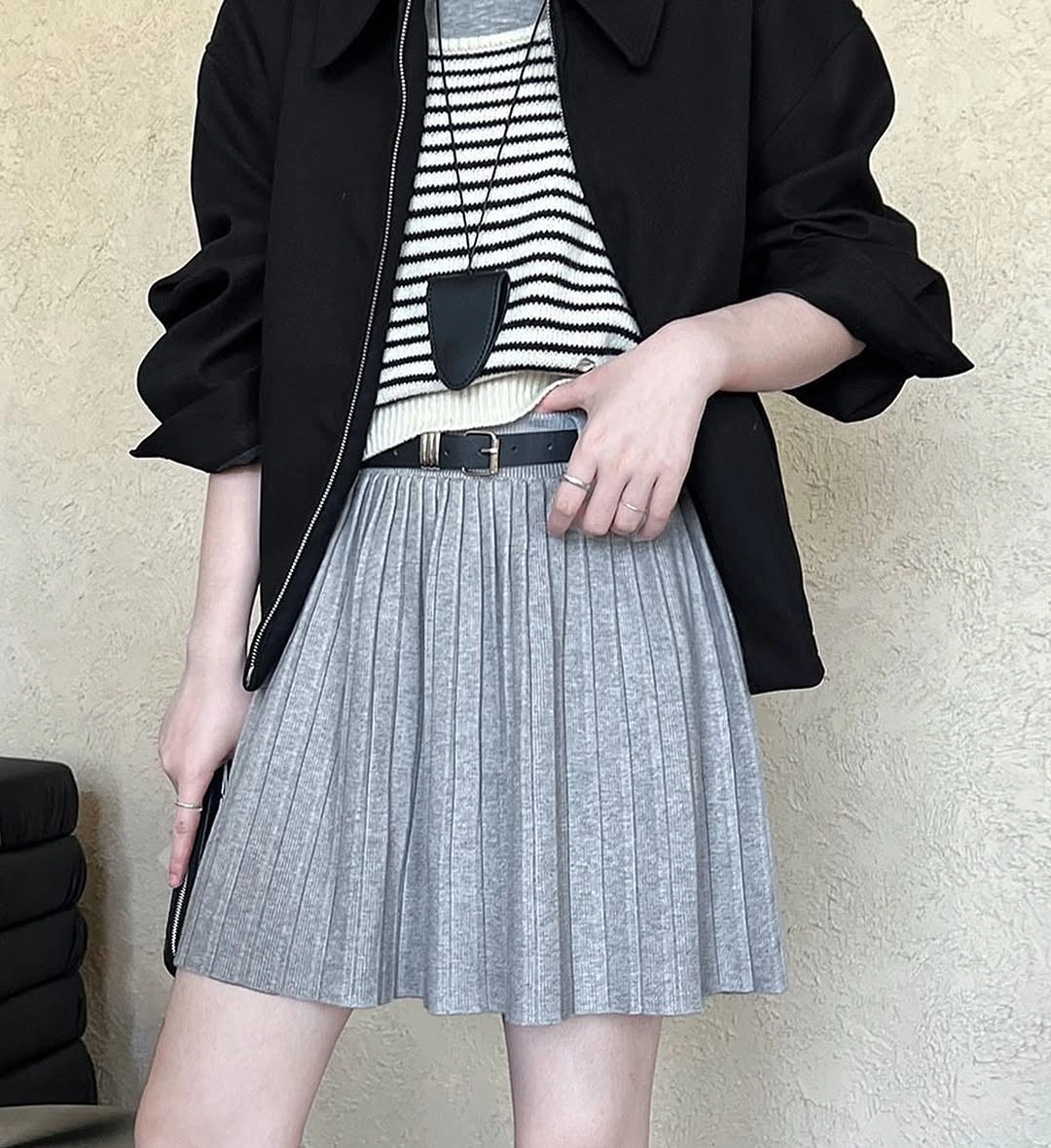 knit skirt outfits fall 2026 Grey Pleated Knit Skirt With A Black Jacket