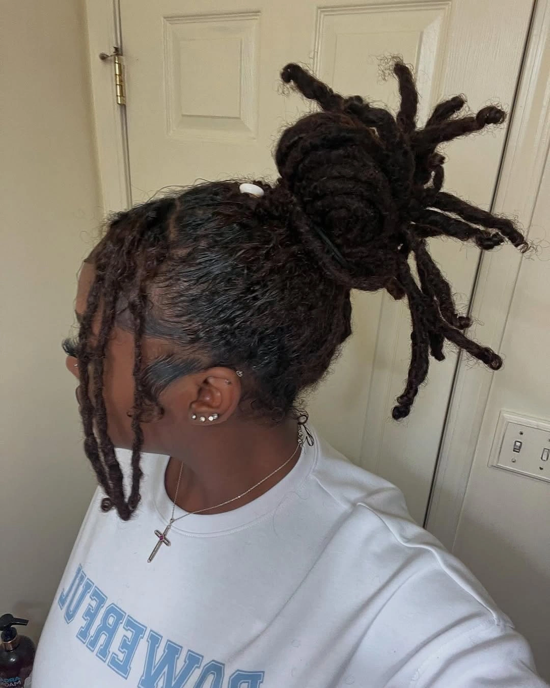 locs hairstyles for black women High Loc Bun With Soft Face-Framing Tendrils