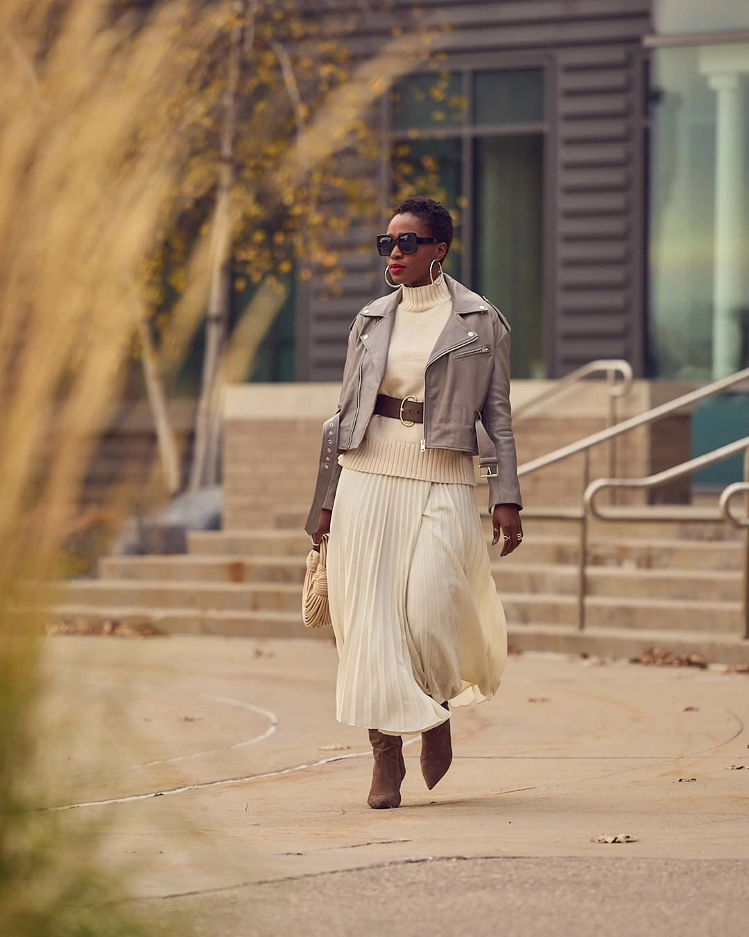 midi skirt fall outfit 2026 Soft Cream Layers With A Pleated Midi Skirt And Leather Jacket