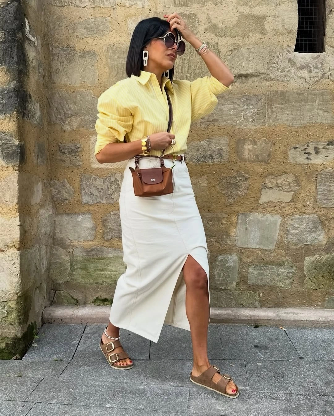 midi skirt fall outfit 2026 Cream Midi Skirt With A Bright Shirt And Casual Accessories