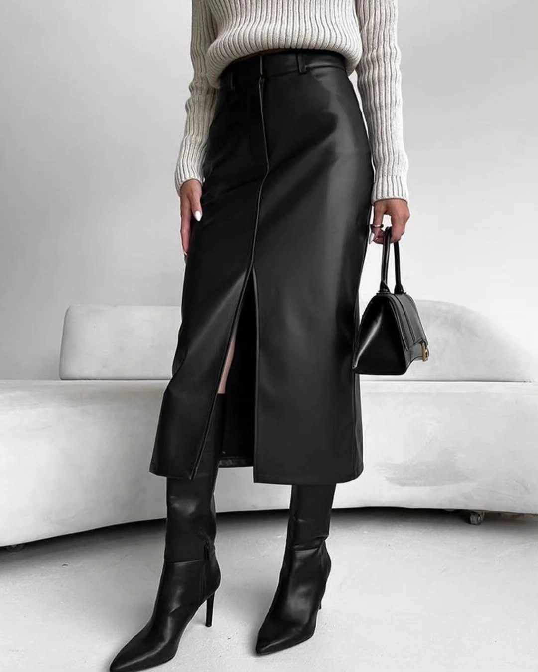 midi skirt fall outfit 2026 Black Leather Midi Skirt With Minimal Knit Styling