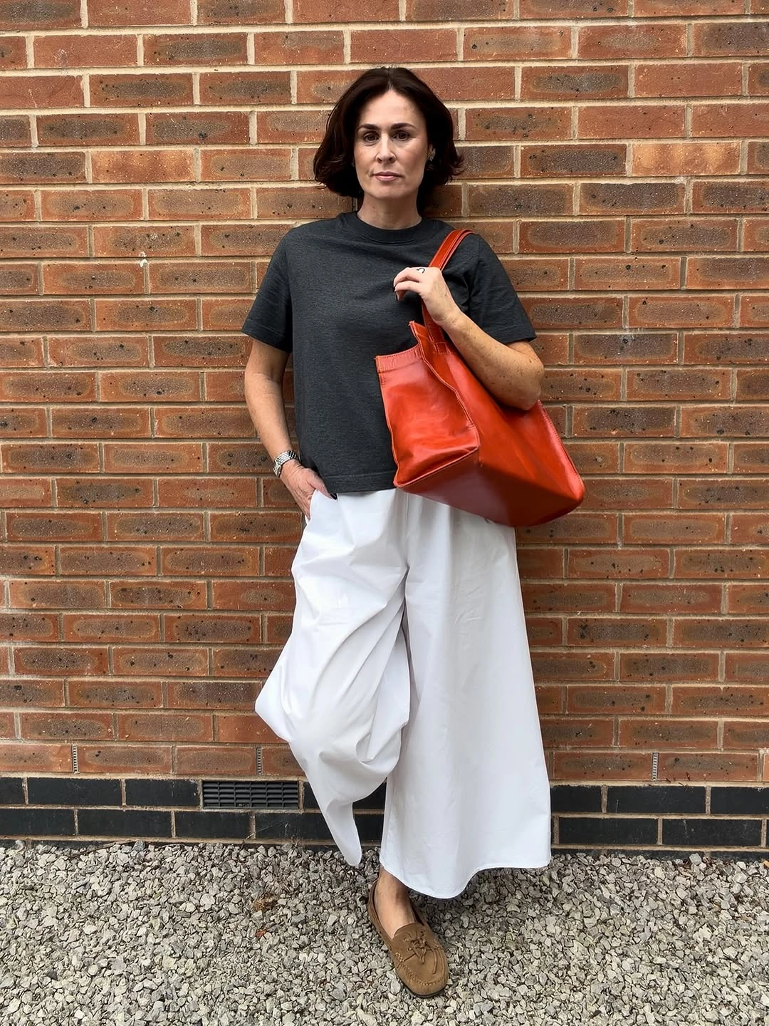 September fashion trends 2026 Black Top With Sculptural White Skirt