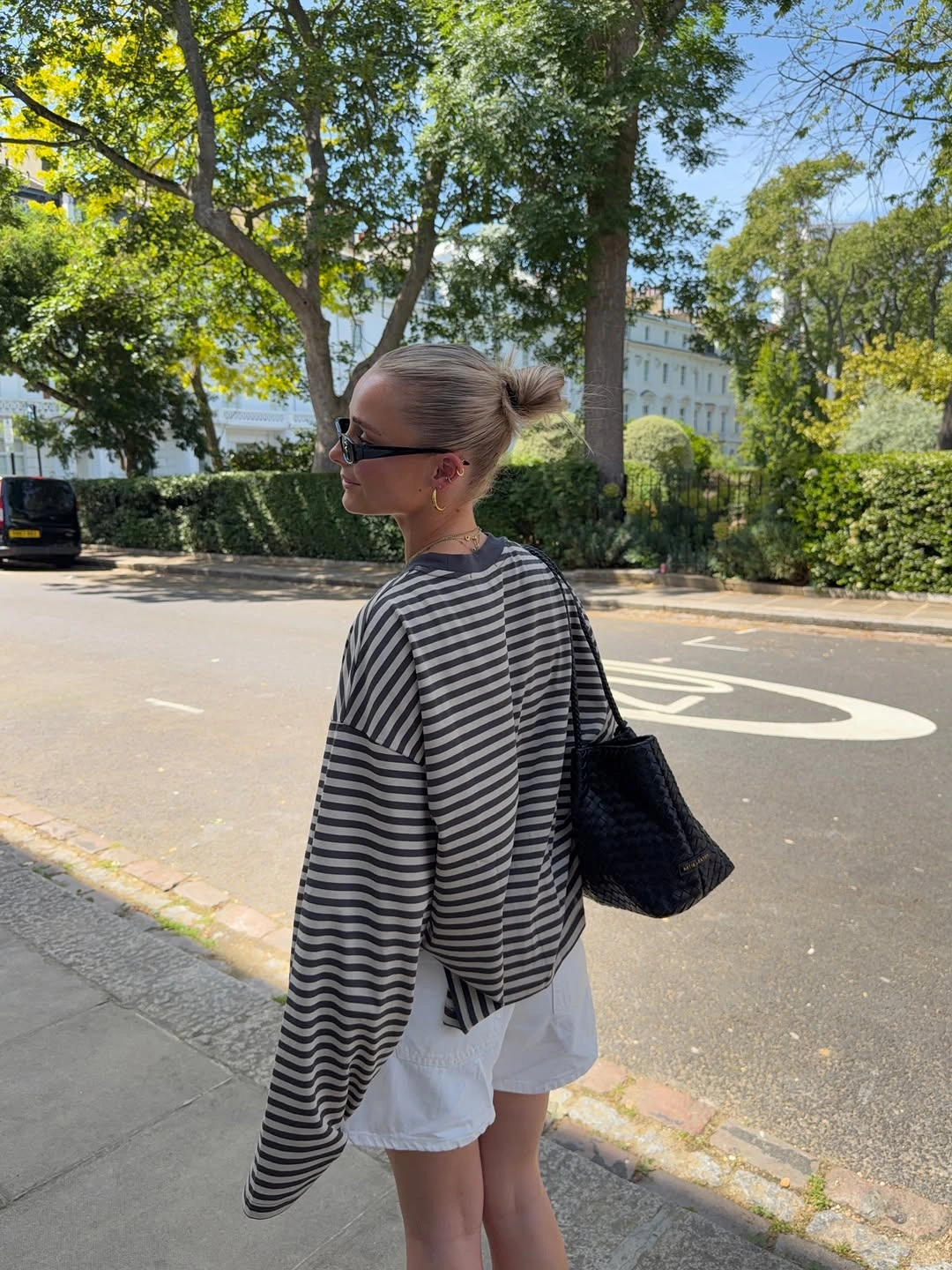 September fashion trends 2026 Striped Oversized Knit Over White Shorts