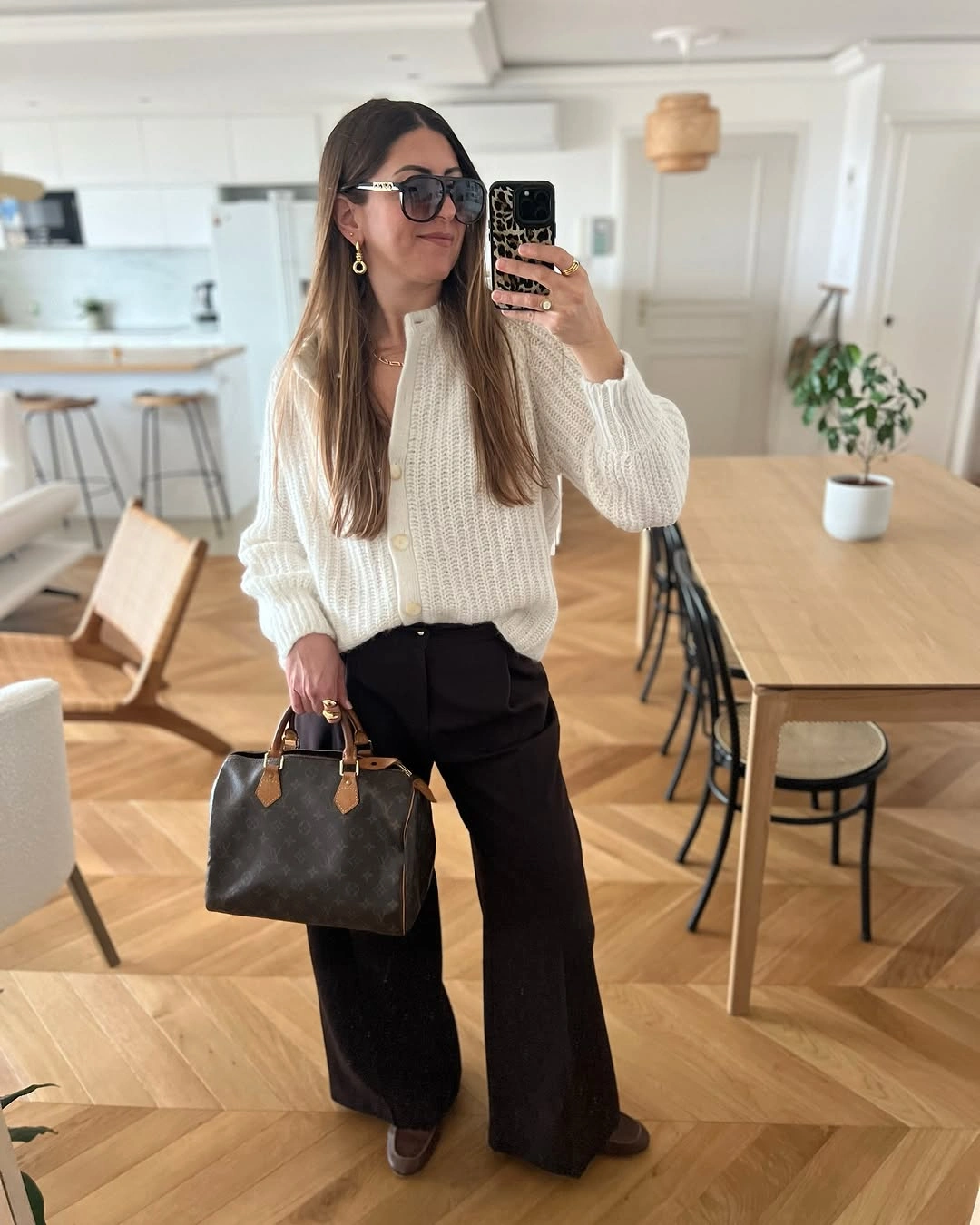 September fashion trends 2026 Chunky Cream Knit With Black Wide Trousers