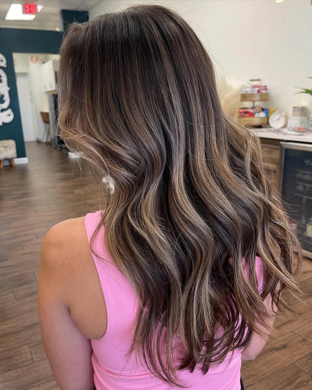 September hairstyles ideas 2026 Brunette Waves With Subtle Caramel Ribbons