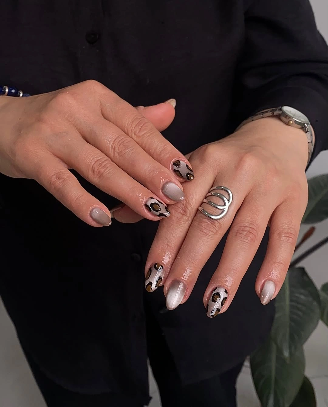 September nail art ideas 2026 Nude Nails With Black Animal Print And White Swirls