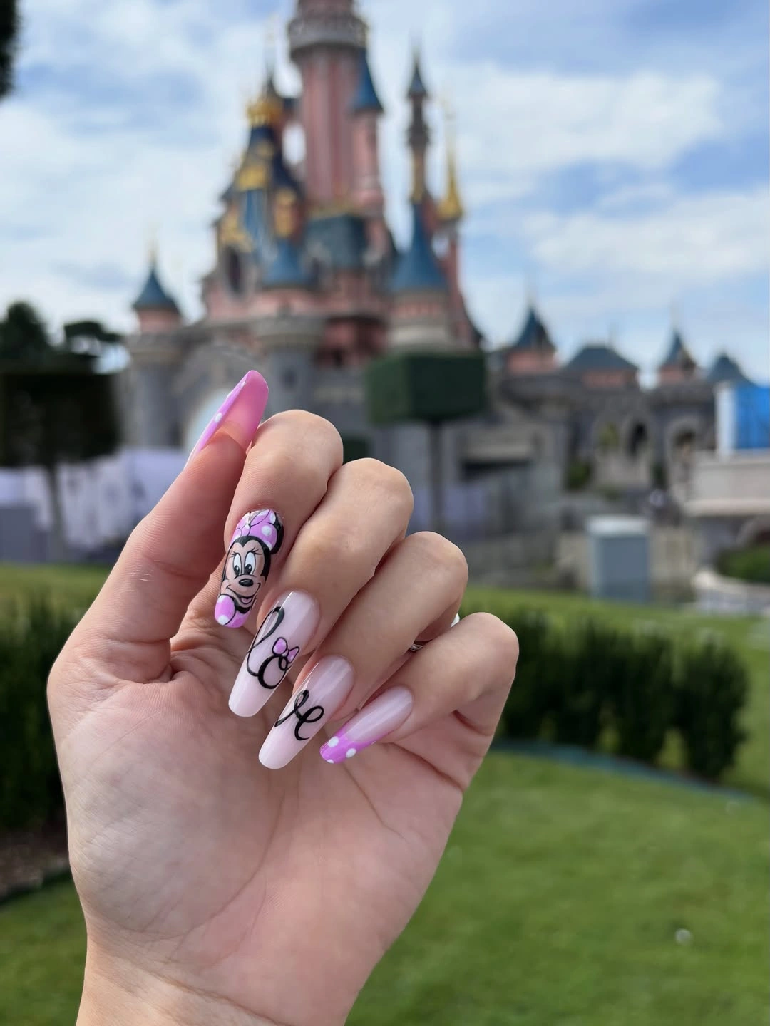 September nail art ideas 2026 Pink Almond Nails With Black Doodle Lettering