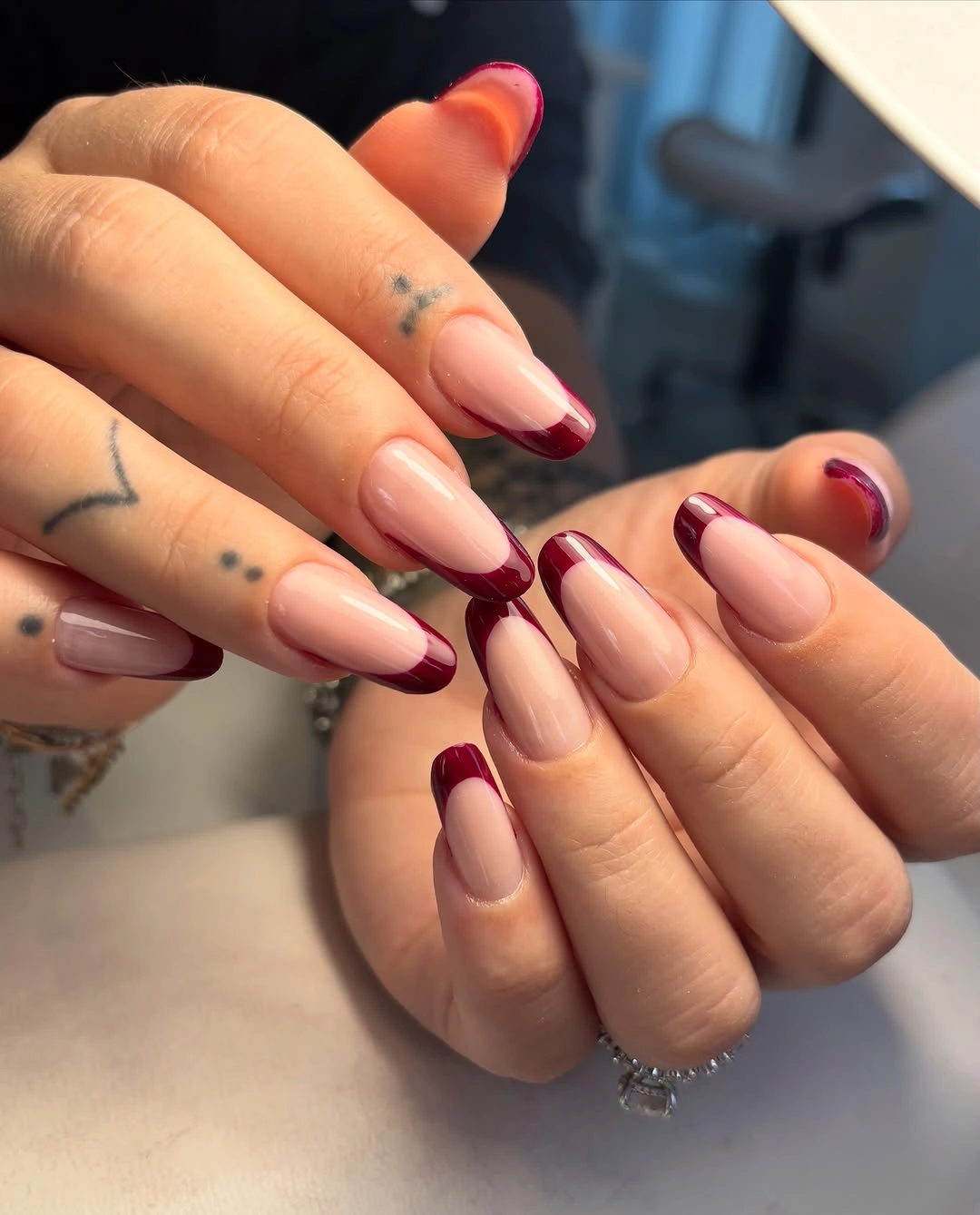 September nail art ideas 2026 Burgundy French Almond Nails With Deep Curved Tips