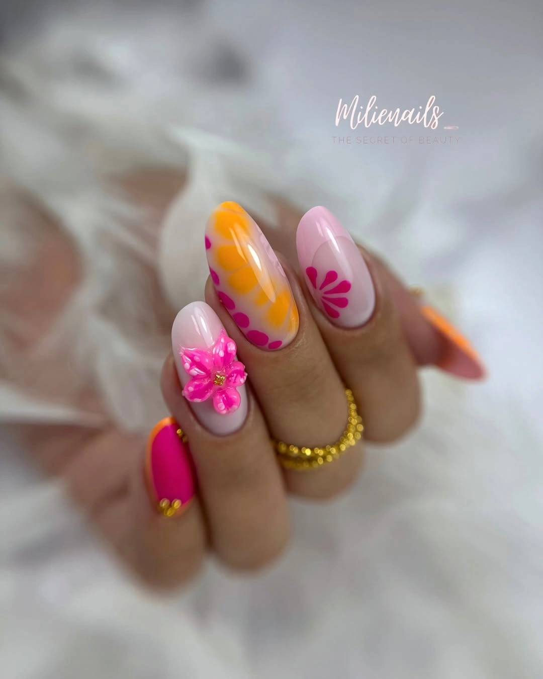 September nail art ideas 2026 Tropical Pink And Orange Almond Nails With Flower Accent