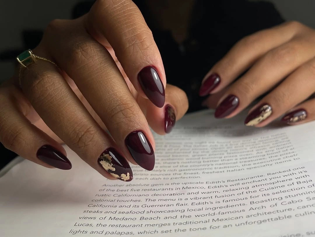 September nail art ideas 2026 Deep Plum Nails With A Nude Floral Accent