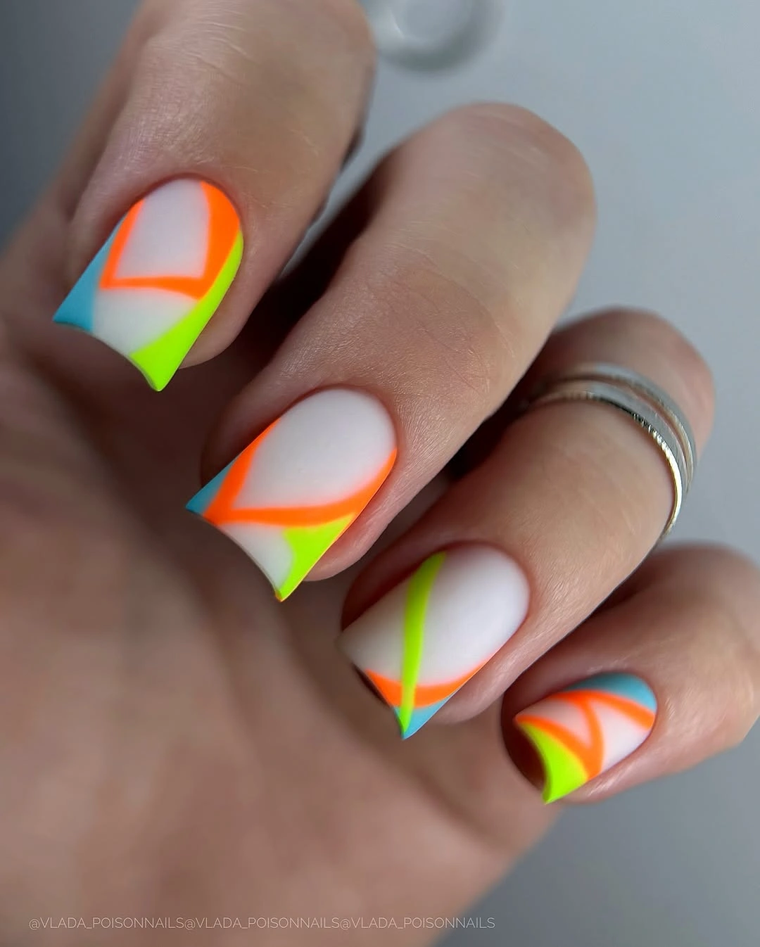 September nail designs 2026 Neon Rainbow French Curves On Nude Short Nails