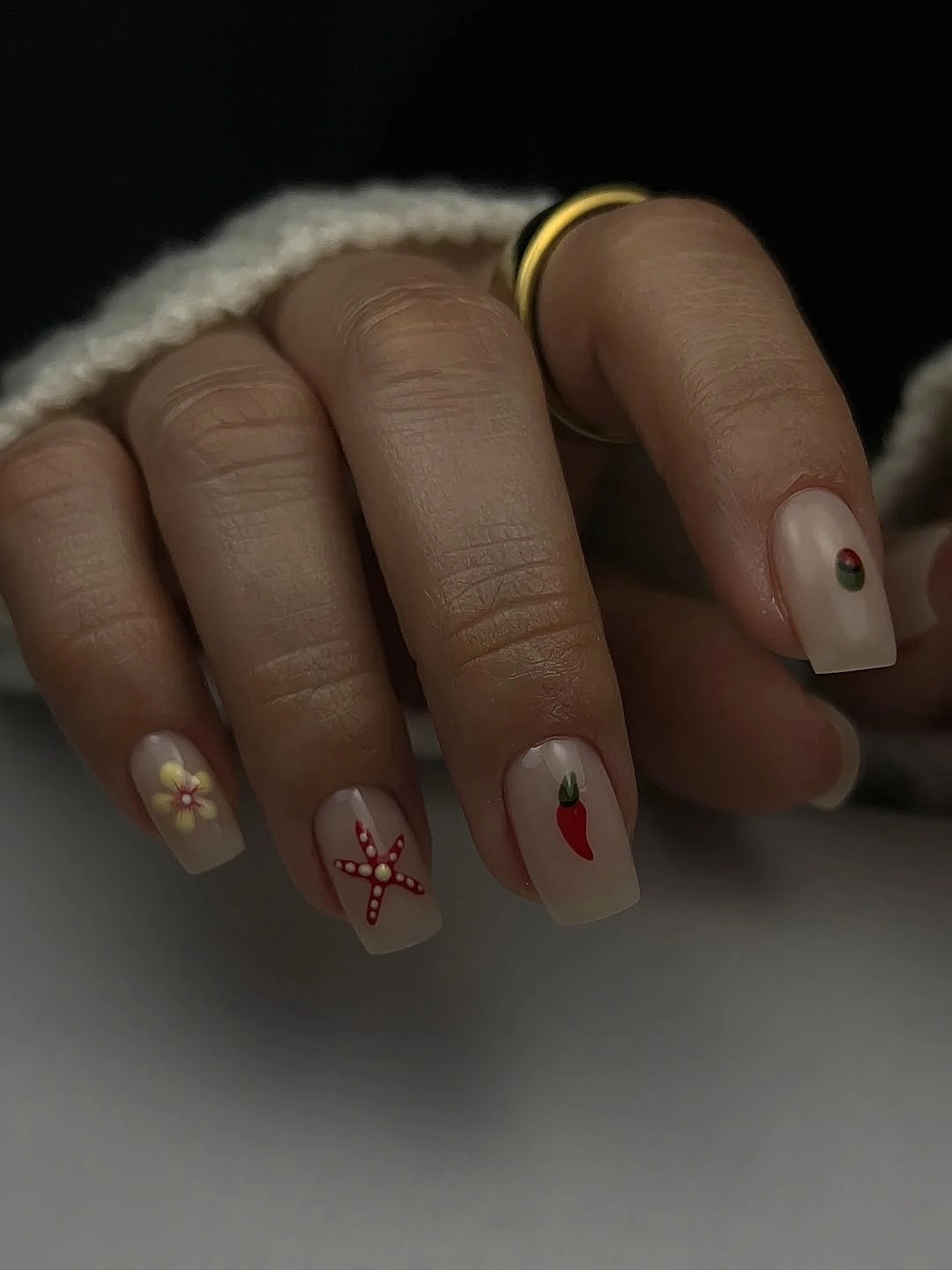 September nail designs 2026 Cream Short Nails With Tiny Red Graphic Motifs