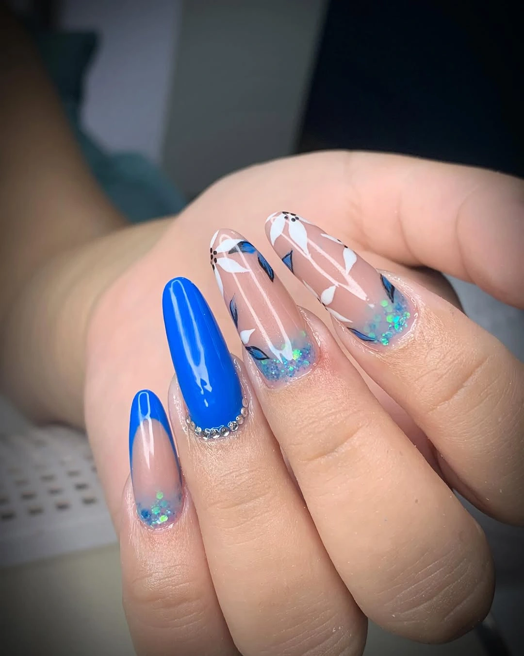 September nail designs 2026 Cobalt And Clear Nails With Geometric Glitter Tips