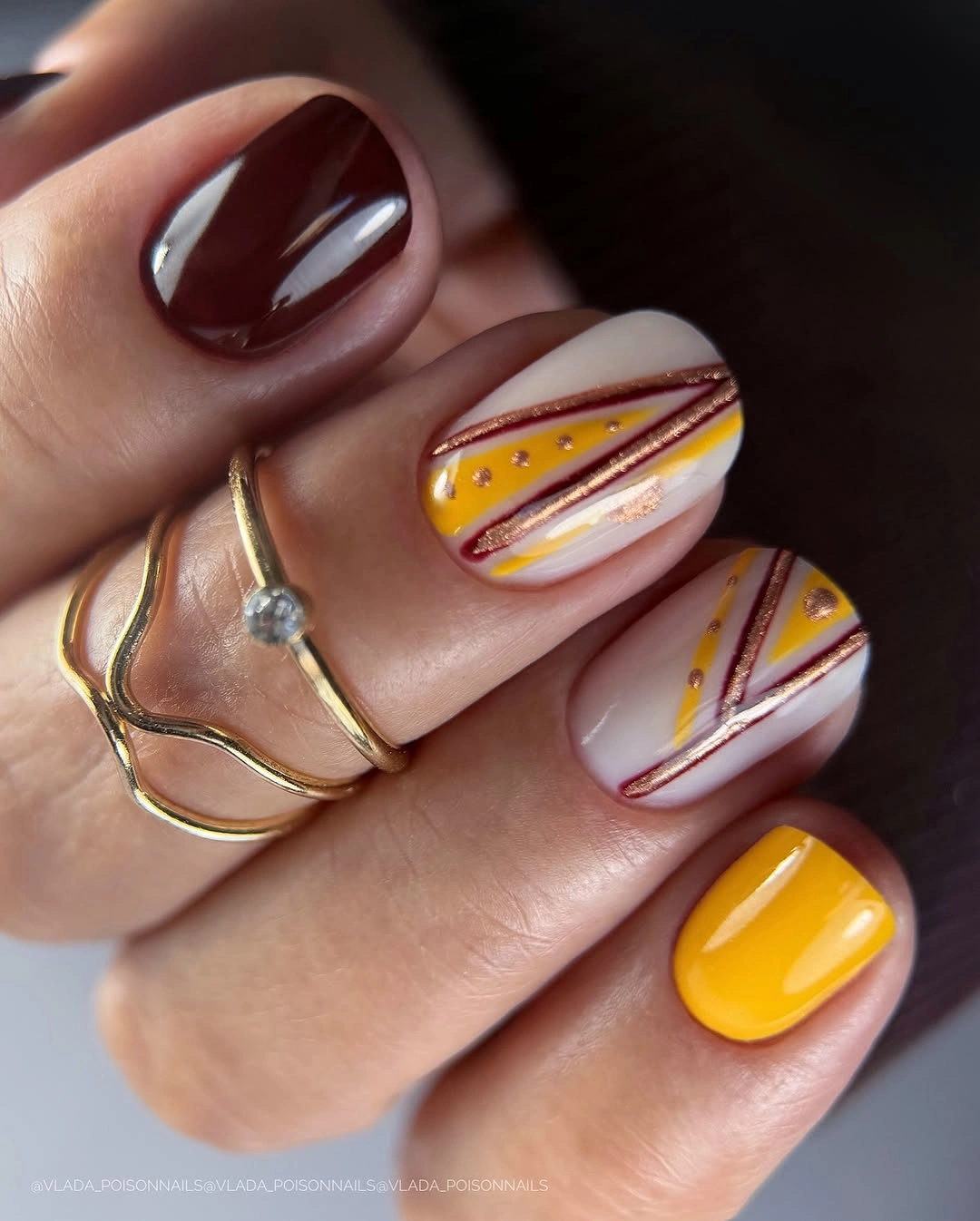September nail designs 2026 Burgundy And Mustard Nails With Striped Line Art