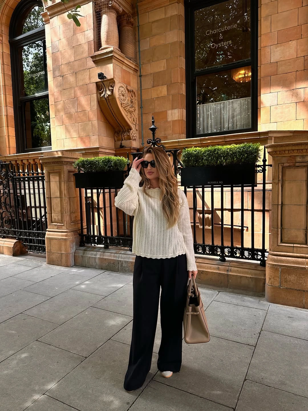 September outfits ideas 2026 Cream Sweater With Black Wide-Leg Trousers