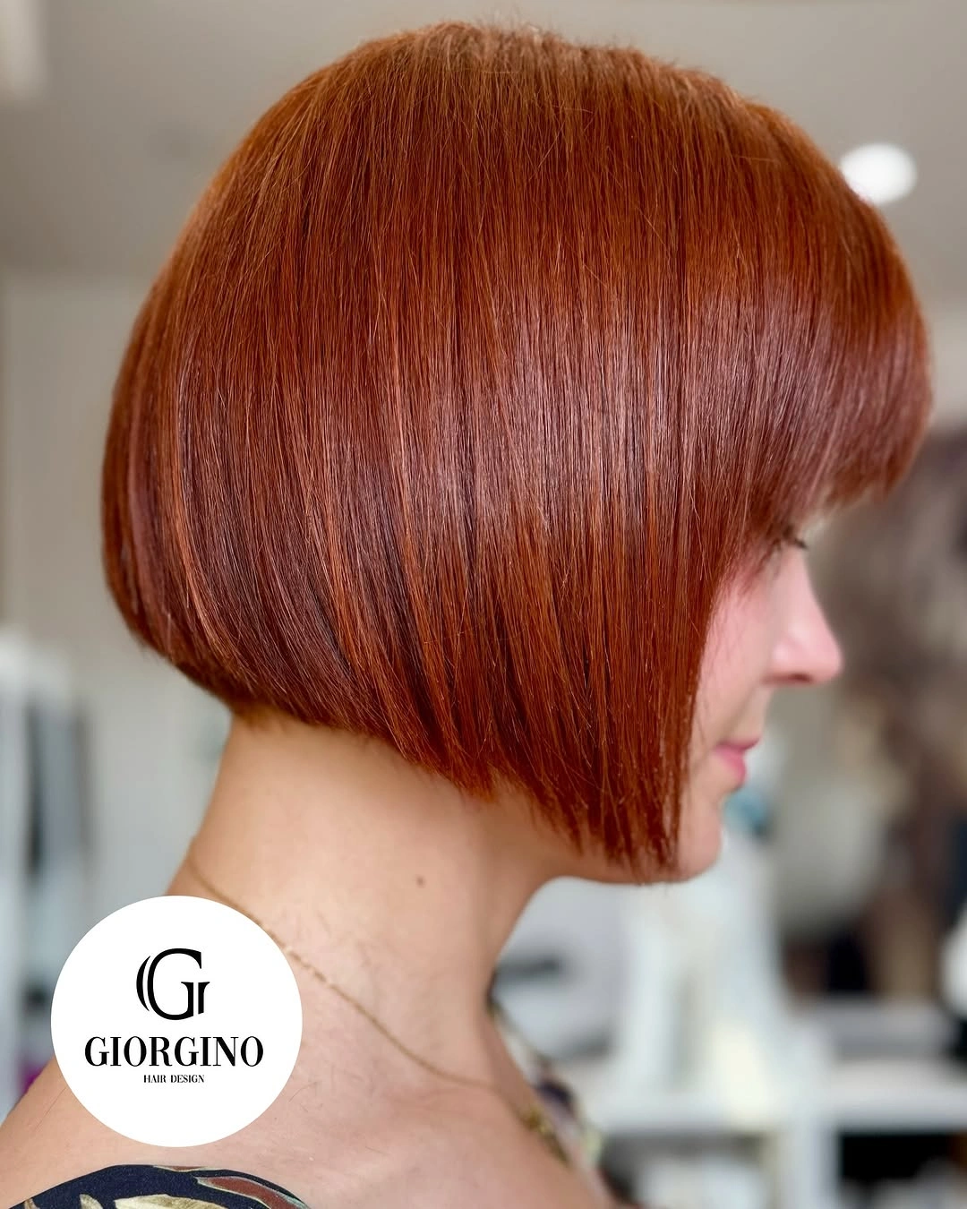 short bobbed hairstyle Classic Copper Precision Bob with Full Fringe