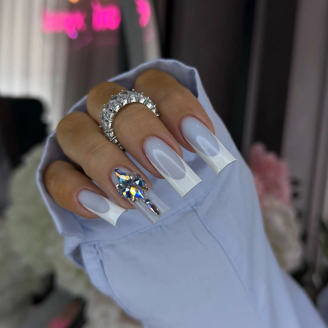 milky blue long nails with clear white geometric accents