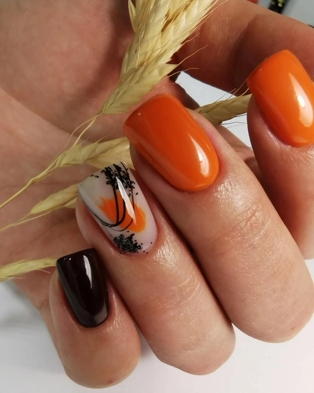 orange black neutral nails with small harvest line details