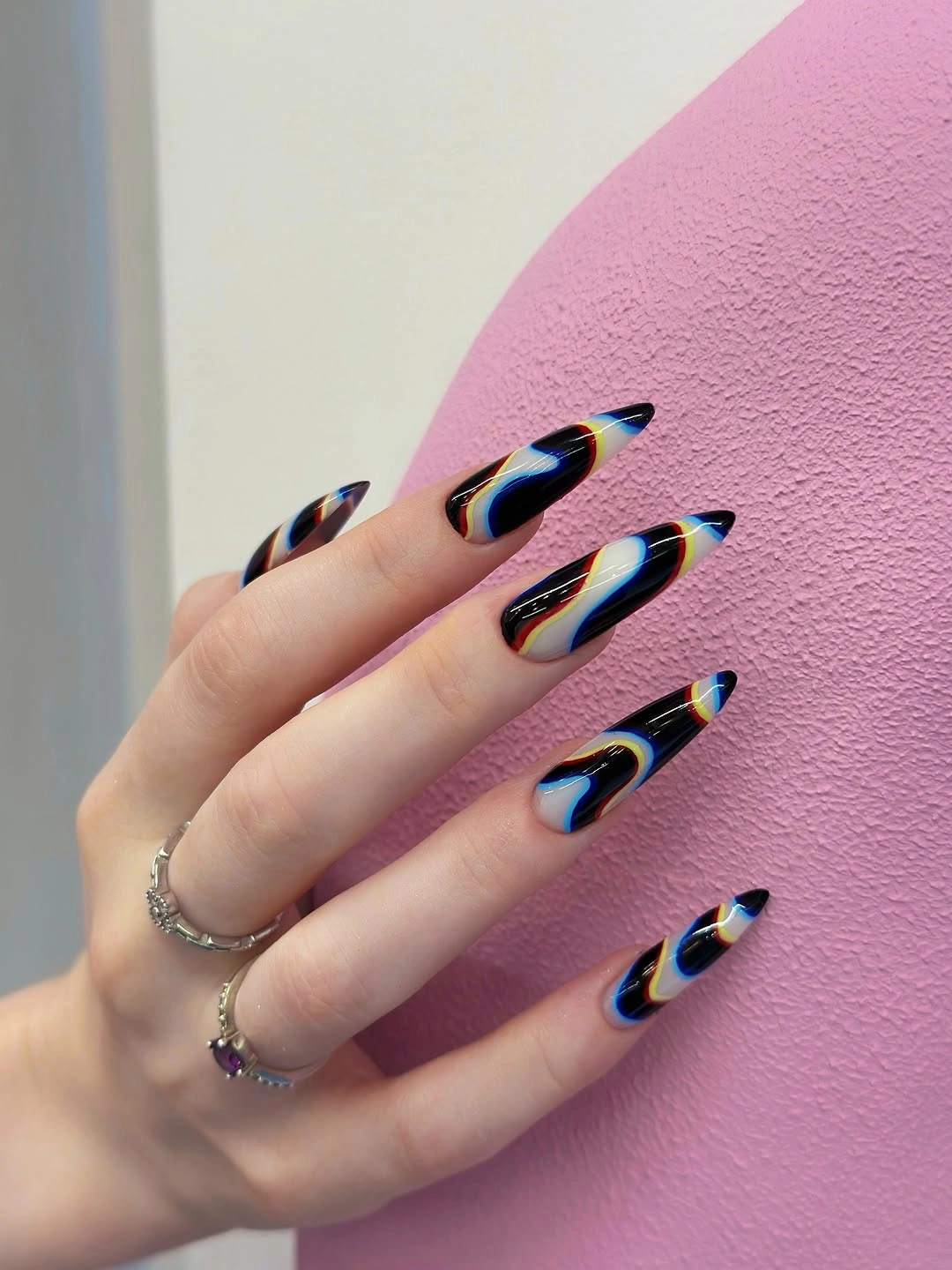 black stiletto nails with blue orange yellow flame lines