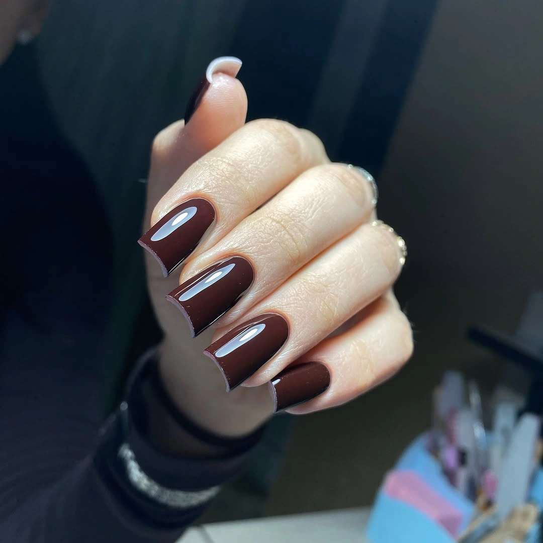 Deep burgundy glossy medium almond nails