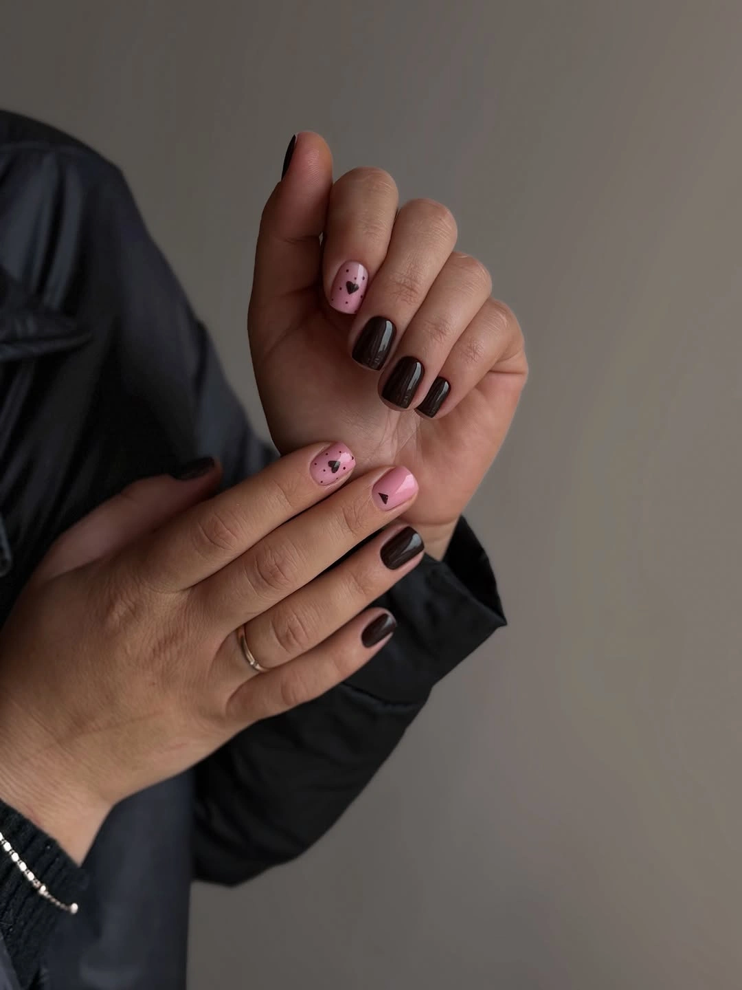 Short espresso almond nails with muted pink accents
