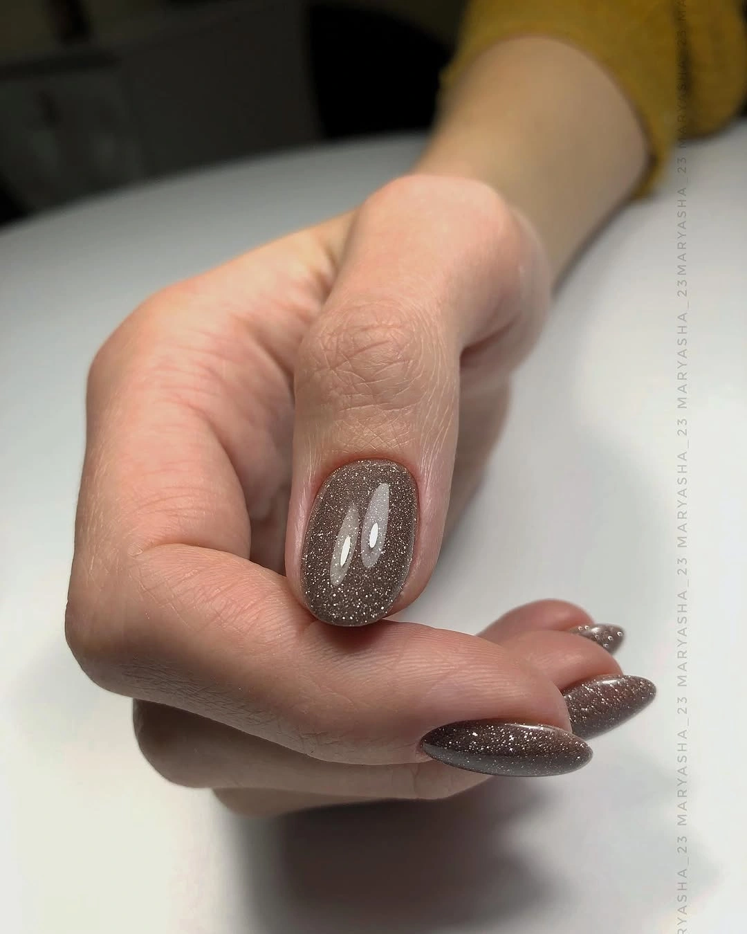 Long taupe brown almond nails with subtle shimmer