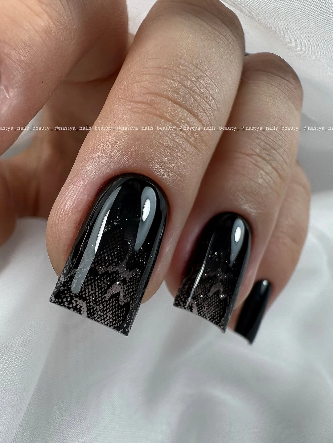 Long black square nails with subtle lace-like texture