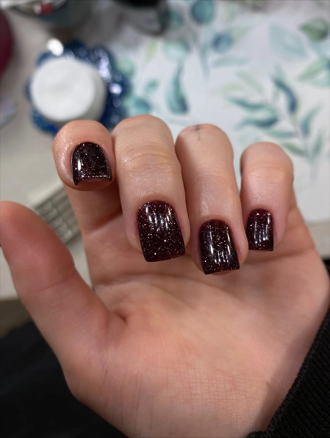 Short square espresso nails with warm fine glitter