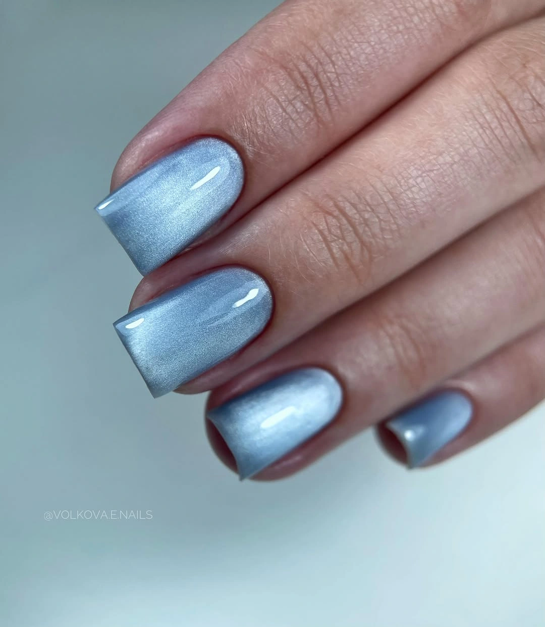 Medium rounded-square nails in reflective icy blue
