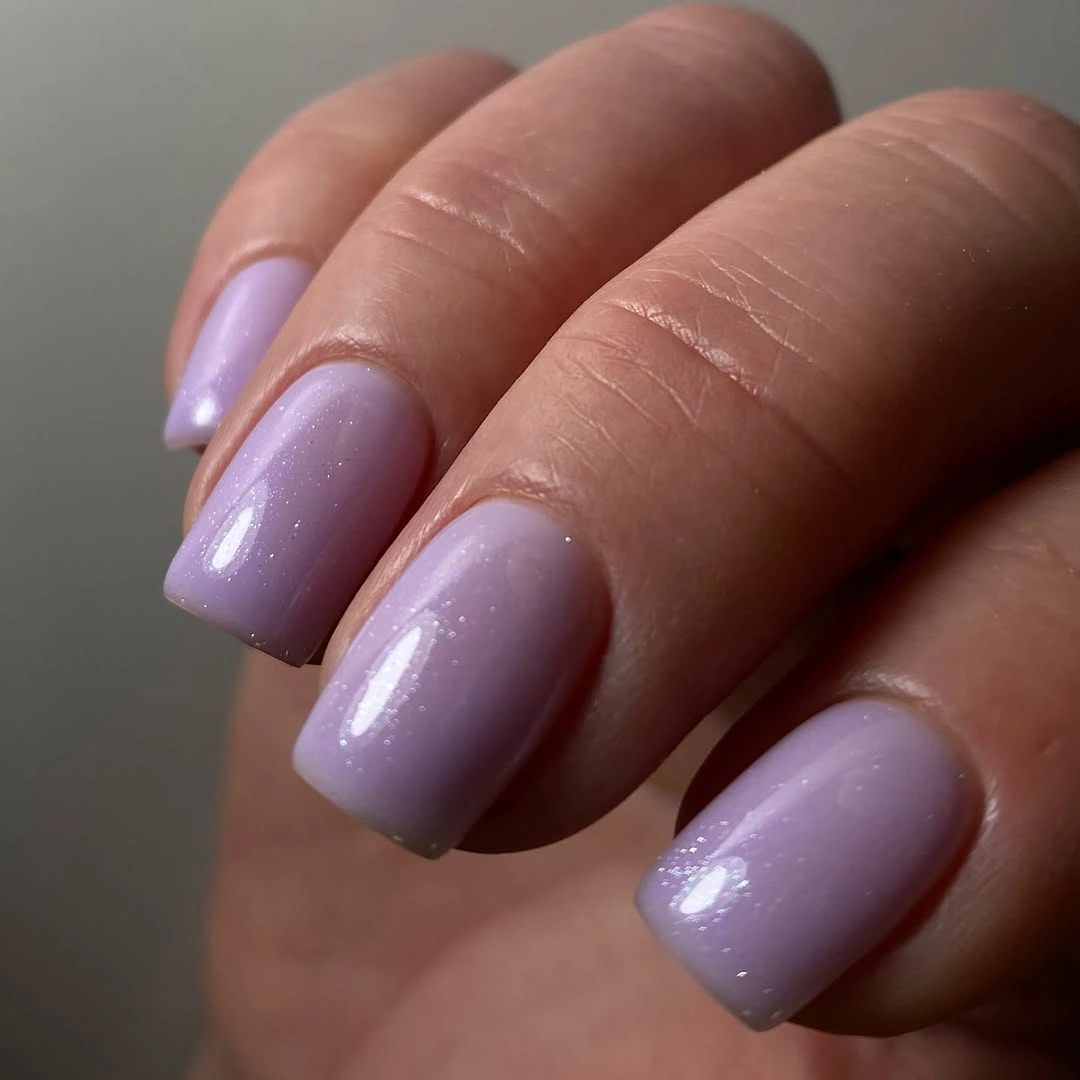 Short rounded-square nails in glossy cool lilac