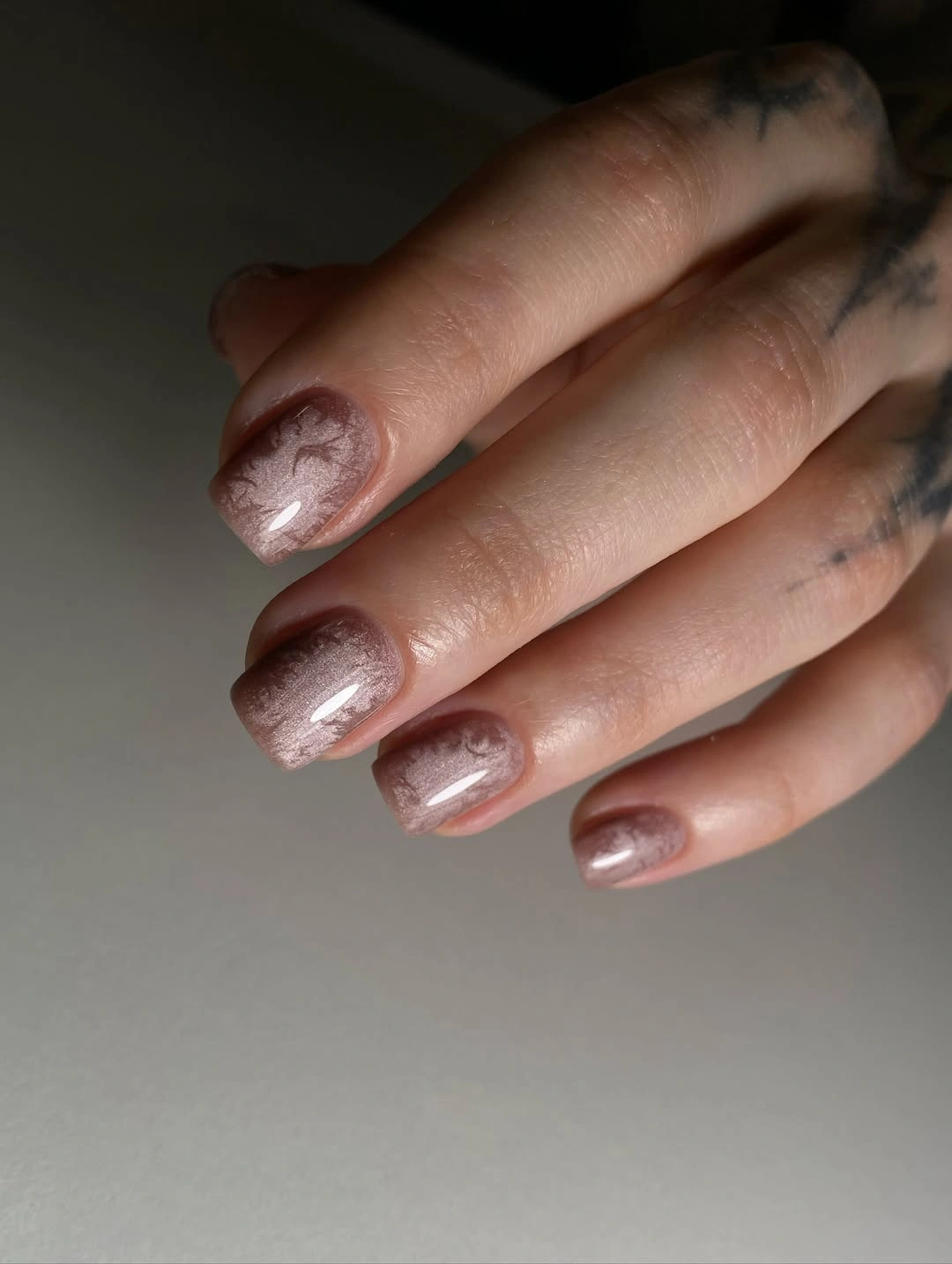 Short taupe square nails with subtle fine shimmer