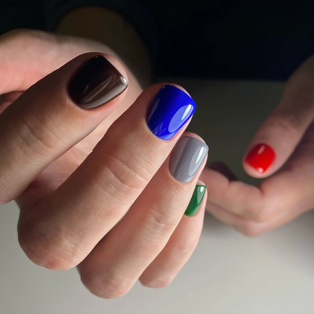 Short multicolor nails in cobalt gray green red and brown