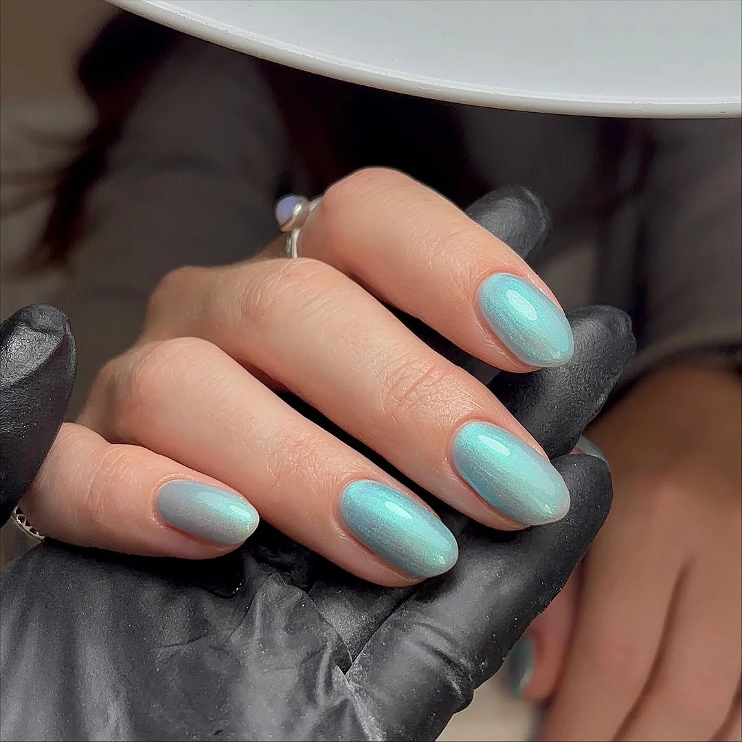 Glossy turquoise almond nails in one saturated color