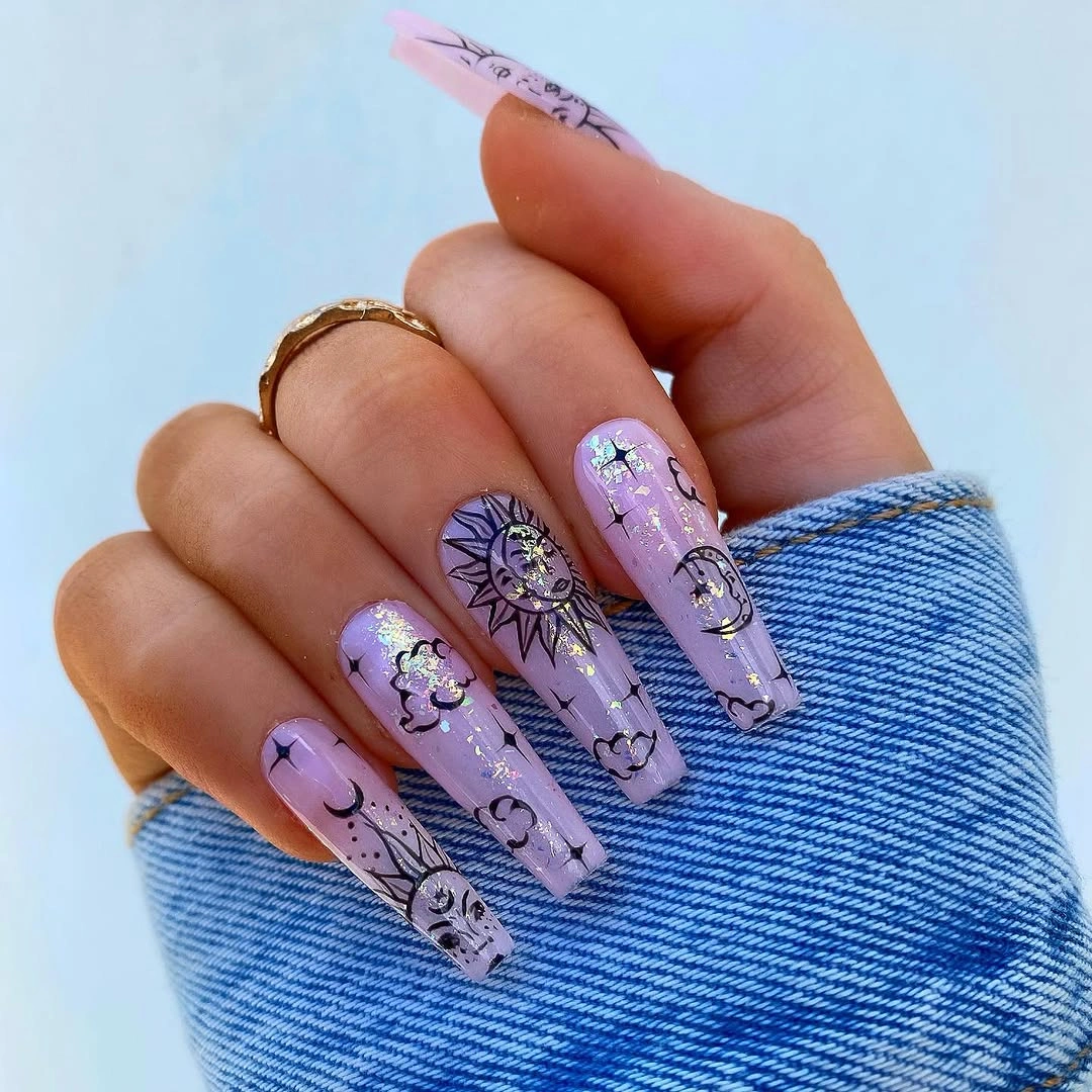 Lavender nails with black ornamental linework and stars