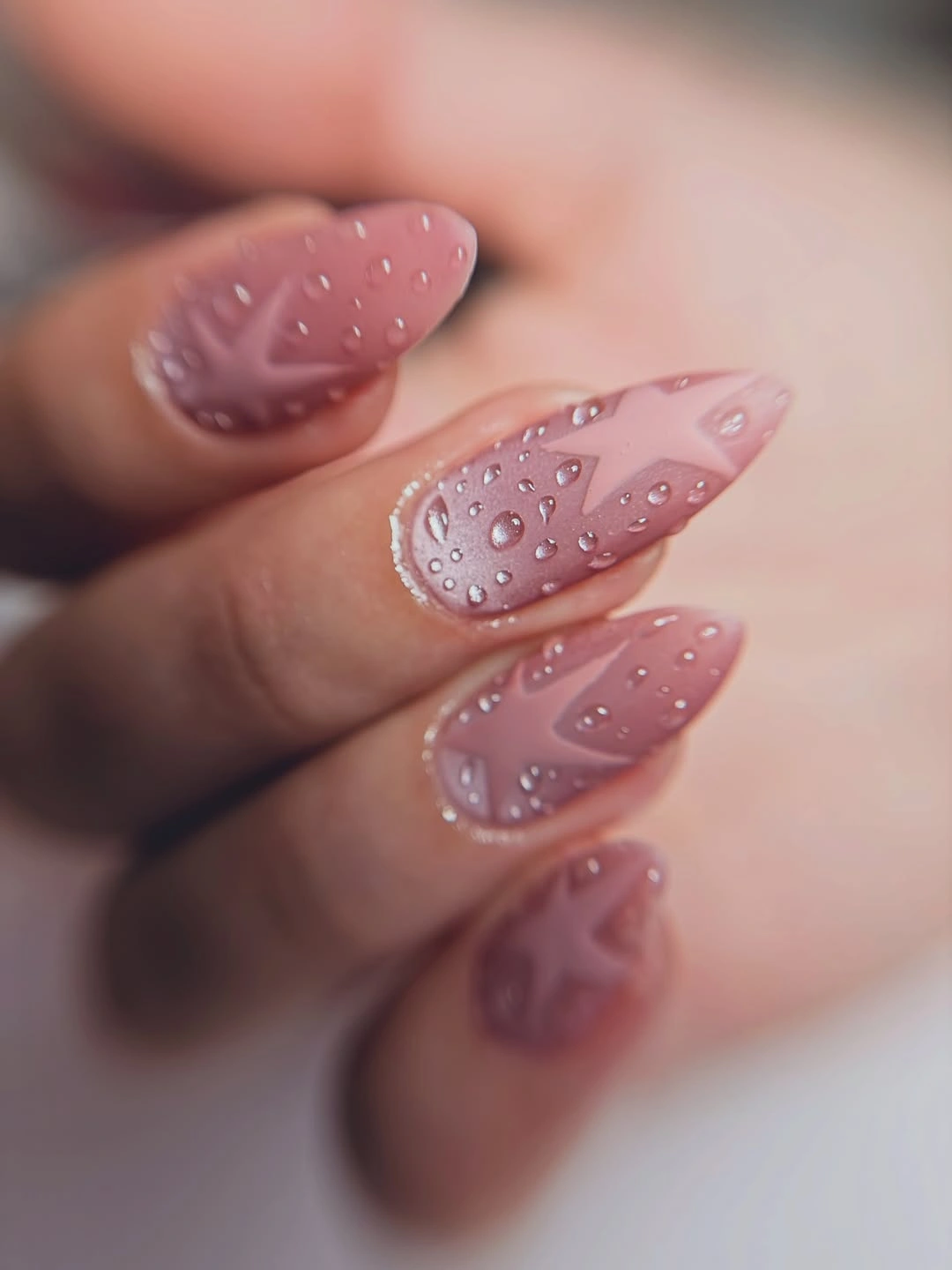 Dusty rose almond nails with pale raised droplet details
